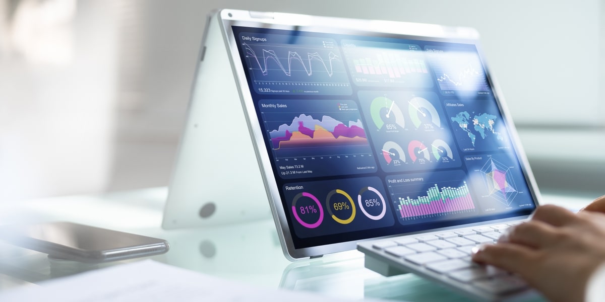 Digital tablet displaying interactive business intelligence charts and key performance indicators