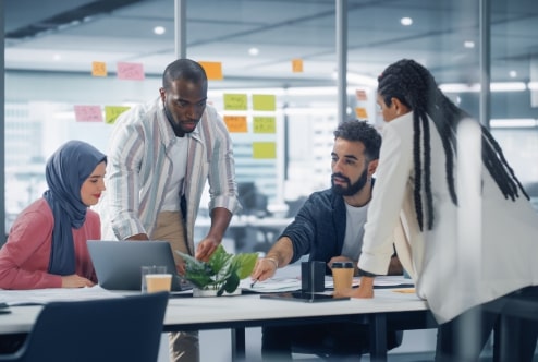 Business professionals collaborating on data-driven MVP development in a modern office