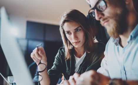 Marketing team collaborates on digital campaign planning using ERP-driven performance insights