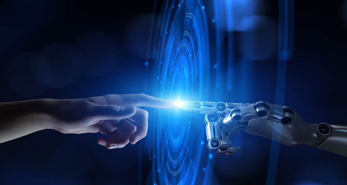 Human and robot hands connecting to symbolize AI collaboration