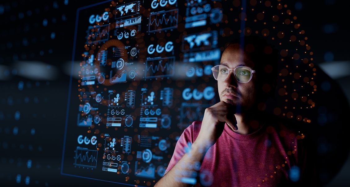 AI engineer examining machine learning code and data patterns