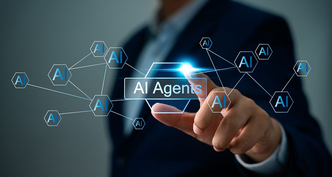 A person in a suit points at a glowing virtual button labeled “AI Agents,” surrounded by hexagonal icons with “AI” connected by digital lines, representing artificial intelligence networking and technology integration.