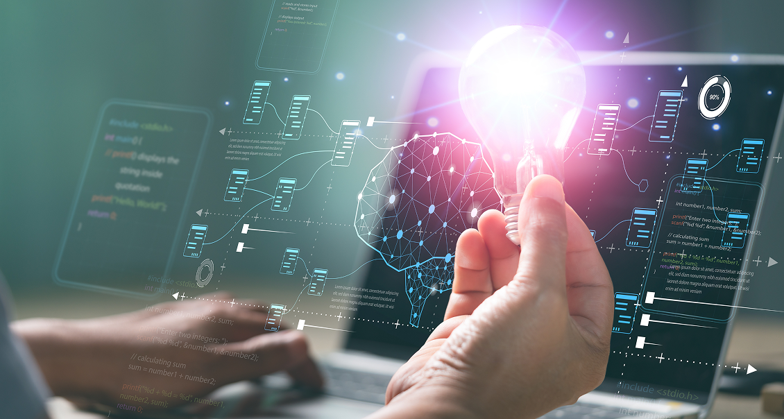 A person holds a glowing lightbulb in front of a laptop displaying digital graphics, including a neural network diagram, data flowcharts, and code. The scene symbolizes innovation and artificial intelligence technology.