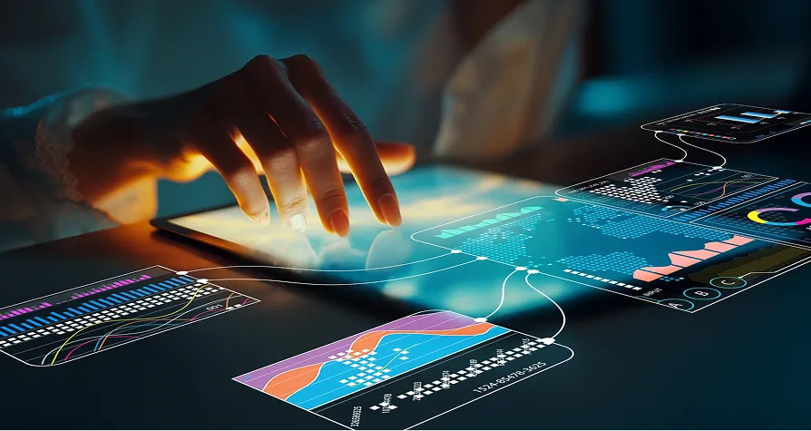 A hand touches a tablet displaying interactive, holographic data charts and graphs in vivid colors, including bar graphs, line charts, and pie charts, symbolizing digital analytics, data visualization, and futuristic technology.