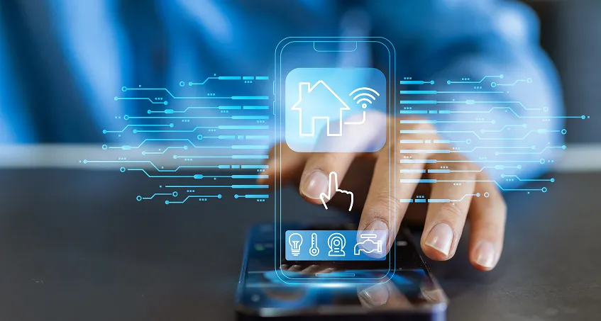 A hand touches a smartphone on a table. Digital icons, including a smart home symbol, appear above the device, representing home automation and wireless connectivity. The background is blurred blue, highlighting the concept of smart technology control.