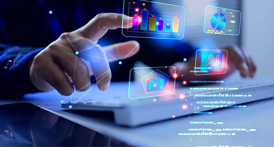 A hand hovers over a computer keyboard with digital graphics floating above, including bar and pie charts, coding lines, a video play icon, and “AI” text, symbolizing technology, artificial intelligence, and data analysis in a modern workspace.